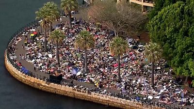 Crowds gather early at Sydney Harbour for New Year’s Eve fireworks