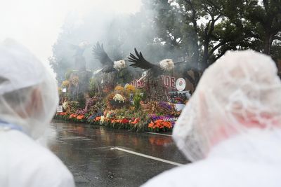 Rain soaks Rose Parade in California and snow squalls hit Midwest and Northeast on first day of 2026