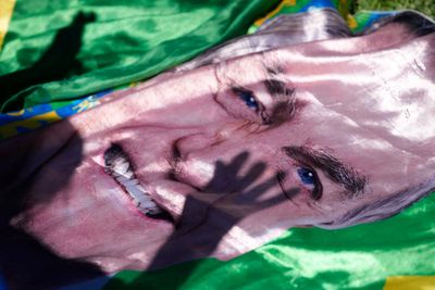 Brazil's Bolsonaro leaves hospital and returns to jail in capital Brasilia