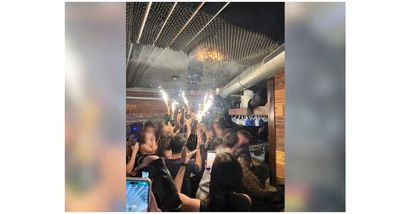 Pictured: Moment champagne bottle sparklers turned New Year's Eve party into deadly inferno in Swiss ski resort bar