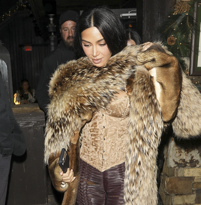Kim Kardashian Steps Into the New Year Wearing a Velvet Corset and Fur Stole