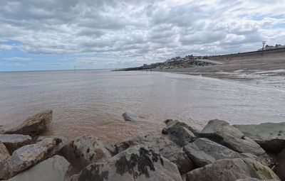 Desperate mum 'came within inches of saving daughter before both swept away by freak wave'