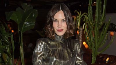 Empty Corners No More: Alexa Chung's Wooden Dresser, Colorful Lamp, and Metallic Bookends Are A Masterclass in Elevating Unused Spaces