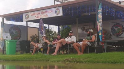 Slow and soggy: life goes on in isolated flood-hit town