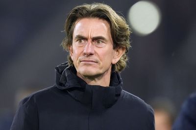 Tottenham coach says he did not notice he was using Arsenal cup