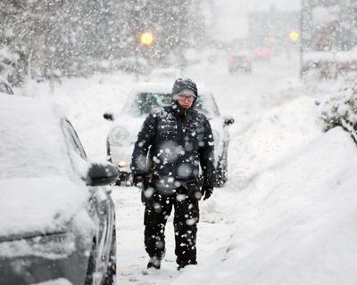 Storm Goretti: rail services suspended, flights cancelled and schools closed across UK – as it happened