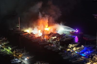 Fire at exclusive Sydney marina sinks three luxury yachts