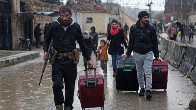 Syrian army says swept Aleppo district after clashes with Kurdish fighters