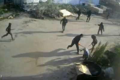 Video shows masked, armed men beating a Palestinian in the occupied West Bank
