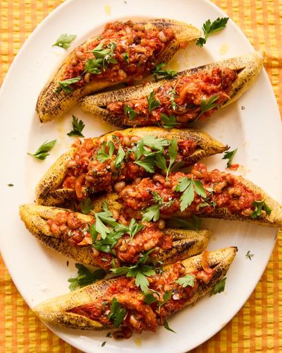 West African sunshine dishes: Toyo Odetunde’s chicken yassa pot pie and stuffed plantain boats – recipes