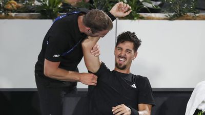 Kokkinakis injury flares, but wins singles comeback