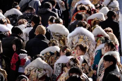 Photos of 20-year-olds gathering in kimonos for Coming of Age Day ceremony in Japan