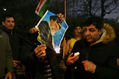 The Latest: Iran eases some restrictions, allows calls abroad as death toll spikes