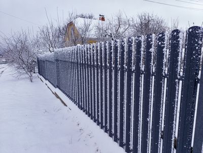 7 Tiny Fence Fixes That Keep Snow From Destroying Panels