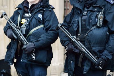 Armed police scrambled and London street evacuated amid stand-off with man 'in possession of knives'