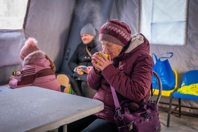 Photos show Ukrainians enduring a frigid winter after Russian strikes knocked out power