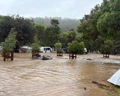 ‘We’ve lost everything, you can see caravans floating away’: flash flooding hits Victoria’s Great Ocean Road