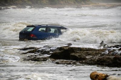 Sydney awaits ‘soggiest weekend of summer’ as Victorian authorities defend flash flood warnings