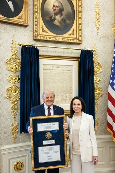 Venezuelan Nobel Peace Prize winner Maria Corina Machado gives her medal to Donald Trump