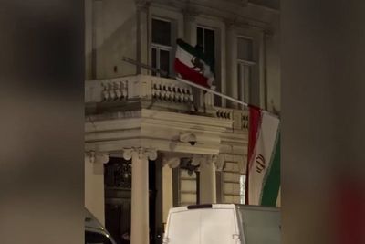 Iranian embassy flag torn down for second time as protesters clash with police