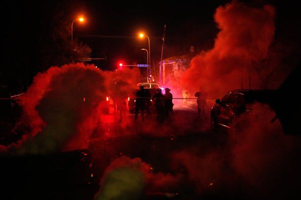 Tear gas floods a Minneapolis family's SUV after they get caught between protesters and officers