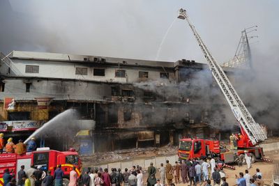 Death toll in Karachi shopping plaza fire rises to 10 as search continues for dozens missing
