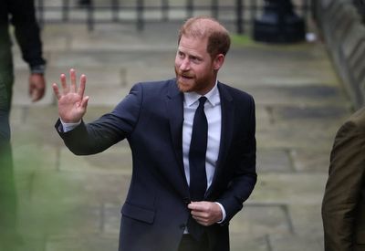 Prince Harry waves to fans as he arrives at High Court for start of high-profile privacy trial