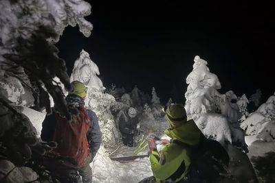 Two skiers stuck in waist-deep snow and only 2% left on their cellphone battery are rescued