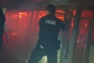 Police forced their way into a burning zoo enclosure to rescue animals from a huge blaze at ZooWorld