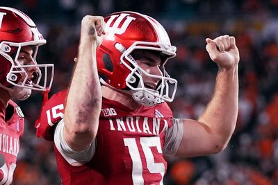 Indiana completes undefeated season and wins first national title, beating Miami 27-21 in CFP final