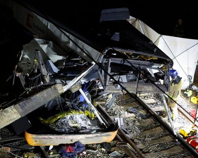 Commuter train near Barcelona hits collapsed wall killing driver and injuring nearly 40