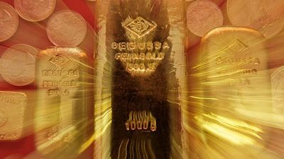 Gold rises to record high and stocks fall as Trump travels to Davos