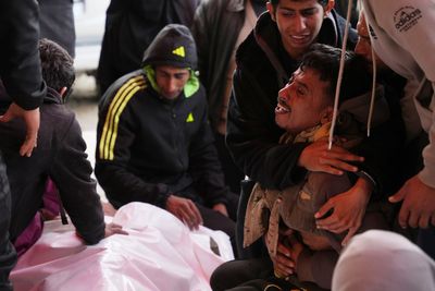 Israeli fire kills 11 Palestinians in Gaza, including two children, local hospital officials say