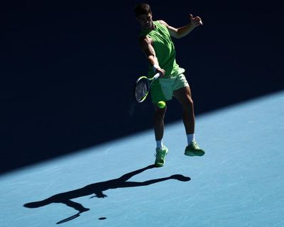 Carlos Alcaraz marches on at Australian Open after golfing with Roger Federer