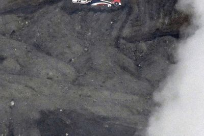 Rescuers spot wreckage possibly from a helicopter that went missing near a volcano in Japan
