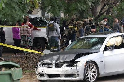 Federal officer opens fire on man near school after he rammed agents with car during immigration raid, DHS says