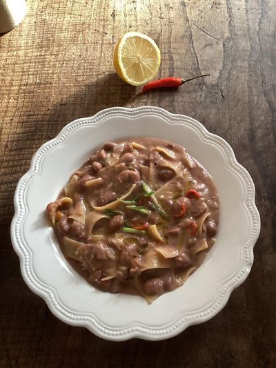 Rachel Roddy’s recipe for pasta e fagioli with coconut, spring onion, chilli and lemon