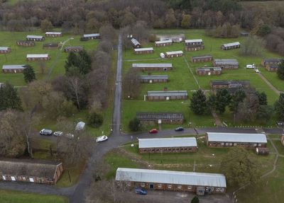 First asylum seekers moved into former army camp under Labour push to shut down migrant hotels