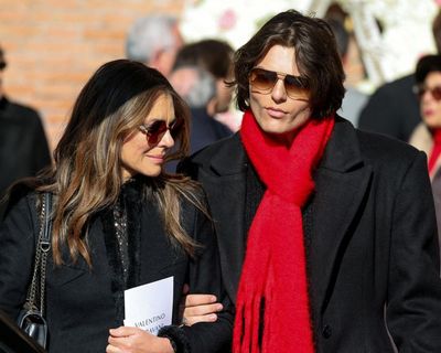 As stars wear black at Valentino’s funeral, tributes are dressed in red