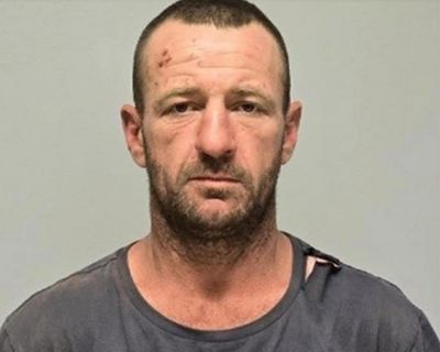 ‘Use extreme caution’: manhunt widens for alleged triple murderer presumed armed in remote NSW