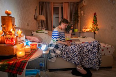 Freezing and in the dark, Kyiv residents are stranded in tower blocks as Russia targets power system