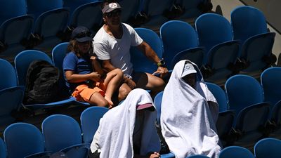 Play resumes as Open schedule backs up after heat delay