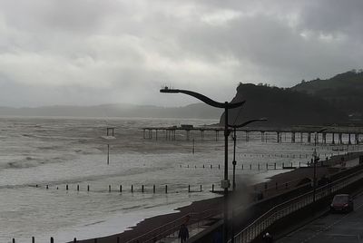Historic pier washes away and rail sea wall crumbles as Storm Ingrid lashes parts of UK