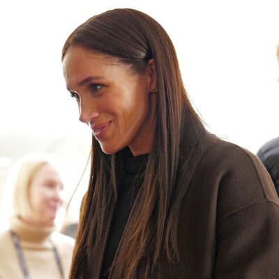 Meghan Markle Wears Veronica Beard Skinny Flare Jeans and a Cashmere Coat for Her Sundance Debut With Prince Harry