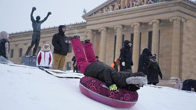 US winter storm turns hills into playgrounds for sledding