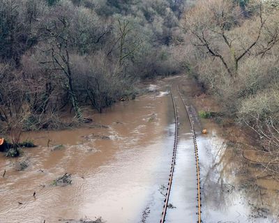 Storm Chandra: flooding and travel disruption hit UK as police warn against travel in parts of Devon – as it happened