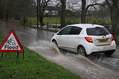 Britons hit by record January rainfall as Storm Chandra causes travel chaos and flooding