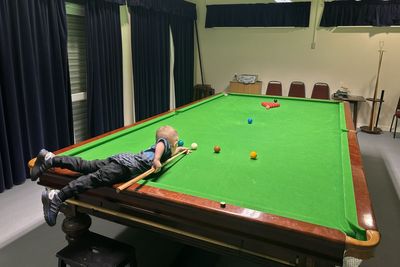 Two-year-old snooker prodigy secures two Guinness World Records for trick shots