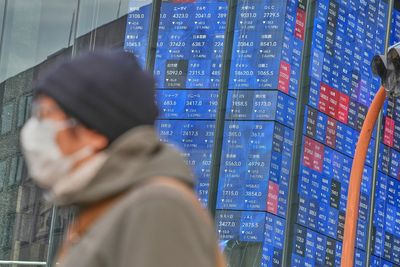 Asian shares are mixed after Wall St sets a record, and the US dollar's value slides further