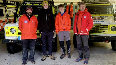 Two teen boys rescue group of adults stuck on snow-covered Mountain slope while wearing jeans and sneakers